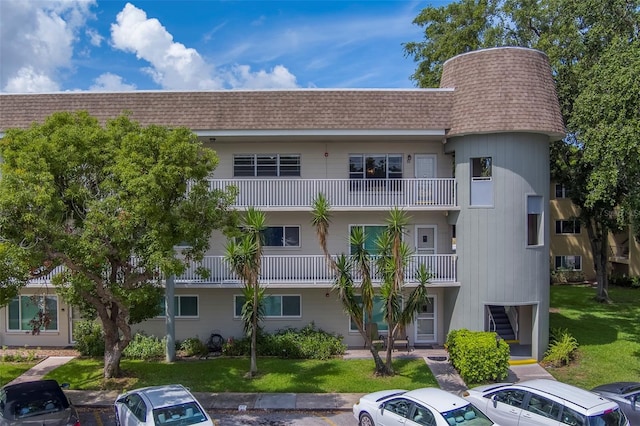 2441 Persian Dr Unit 61, Clearwater, FL 33763 - view of property featuring uncovered parking