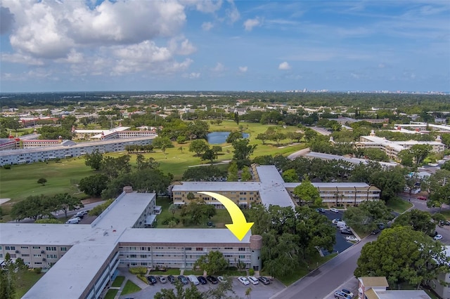 2441 Persian Dr Unit 61, Clearwater, FL 33763 - aerial view of a golf course, apartment complex / building, and a large body of water