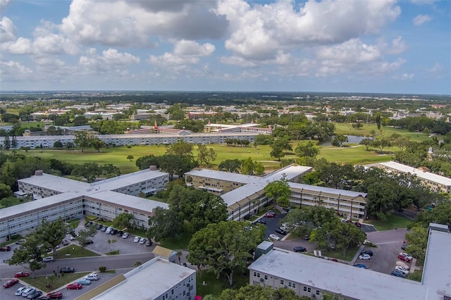 2441 Persian Dr Unit 61, Clearwater, FL 33763 - bird's eye view of a golf course, apartment complex, and a large body of water