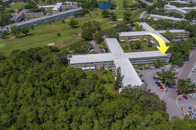 2441 Persian Dr Unit 61, Clearwater, FL 33763 - aerial view of property and surrounding area with a golf course, a nearby body of water, and apartment complex