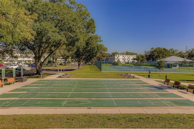 2441 Persian Dr Unit 61, Clearwater, FL 33763 - surrounding community with shuffleboard and a tennis court