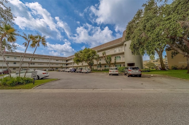 2441 Persian Dr Unit 61, Clearwater, FL 33763 - view of apartment building / complex with uncovered parking