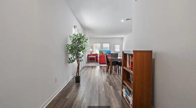 10448 Ladybug Cv, Parrish, FL 34219 - corridor featuring dark wood finished floors and baseboards