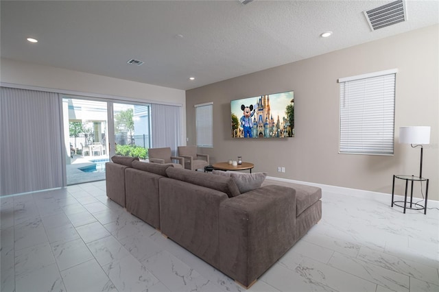 1430 Reunion Blvd, Reunion, FL 34747 - living room with light marble finish floors, baseboards, and recessed lighting