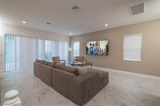 1430 Reunion Blvd, Reunion, FL 34747 - living area featuring light marble finish flooring, baseboards, and recessed lighting