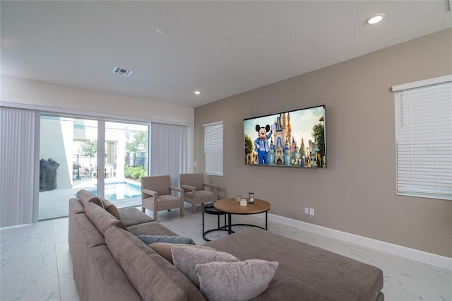 1430 Reunion Blvd, Reunion, FL 34747 - living area with light marble finish floors, recessed lighting, and baseboards