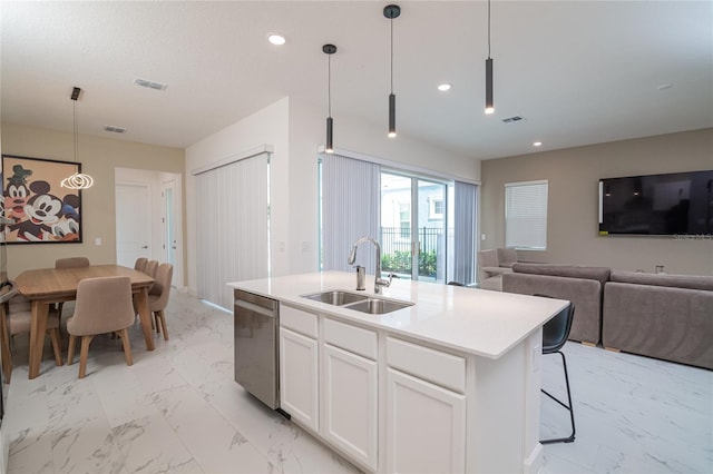1430 Reunion Blvd, Reunion, FL 34747 - kitchen featuring a sink, stainless steel dishwasher, light marble finish floors, open floor plan, and white cabinets
