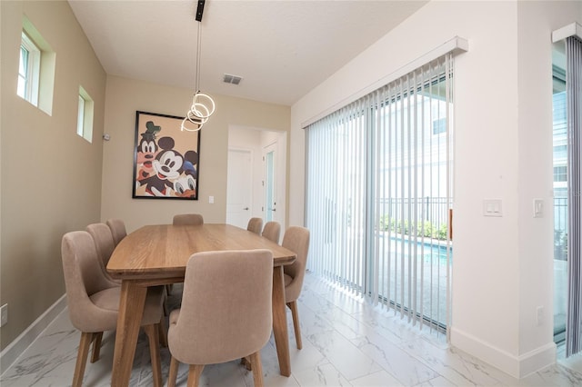 1430 Reunion Blvd, Reunion, FL 34747 - dining area featuring light marble finish floors and baseboards