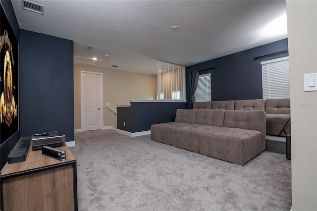 1430 Reunion Blvd, Reunion, FL 34747 - living room featuring carpet, a textured ceiling, and plenty of natural light