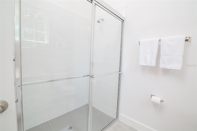 1430 Reunion Blvd, Reunion, FL 34747 - full bath featuring a shower stall and baseboards
