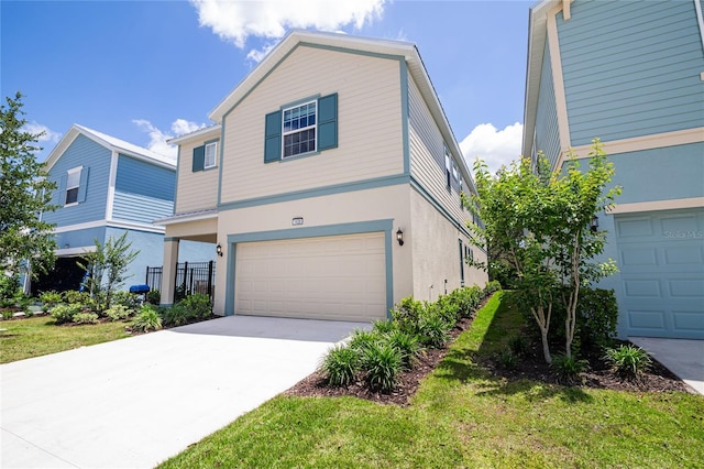 1430 Reunion Blvd, Reunion, FL 34747 - view of front of property featuring a garage, concrete driveway, stucco siding, and a front lawn