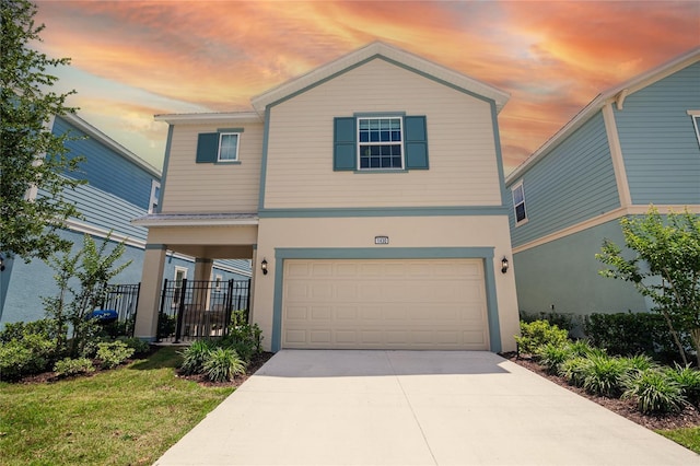 1430 Reunion Blvd, Reunion, FL 34747 - view of front of house with a garage, stucco siding, and driveway