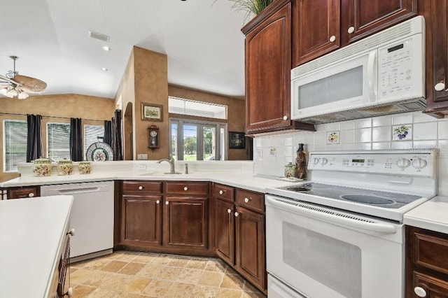 3402 Stonebridge Trl, Valrico, FL 33596 - kitchen with white appliances, tasteful backsplash, light countertops, and lofted ceiling