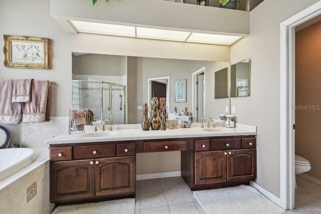 3402 Stonebridge Trl, Valrico, FL 33596 - bathroom with a stall shower, double vanity, and tile patterned floors