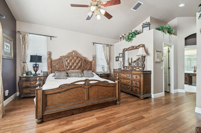3402 Stonebridge Trl, Valrico, FL 33596 - bedroom with lofted ceiling, baseboards, light wood-type flooring, and a ceiling fan