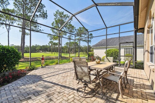 3402 Stonebridge Trl, Valrico, FL 33596 - view of patio featuring outdoor dining space, a lanai, and view of golf course
