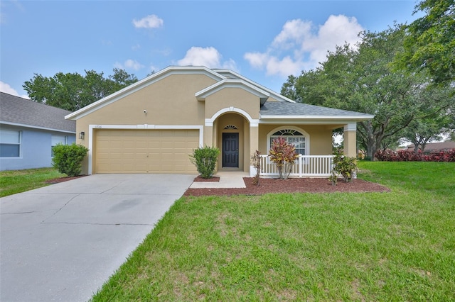 11726 S Stone Ln, Riverview, FL 33569 - view of front of home with stucco siding, concrete driveway, an attached garage, a front yard, and covered porch