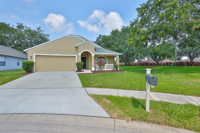 11726 S Stone Ln, Riverview, FL 33569 - view of front facade featuring concrete driveway, stucco siding, a front lawn, a garage, and a porch