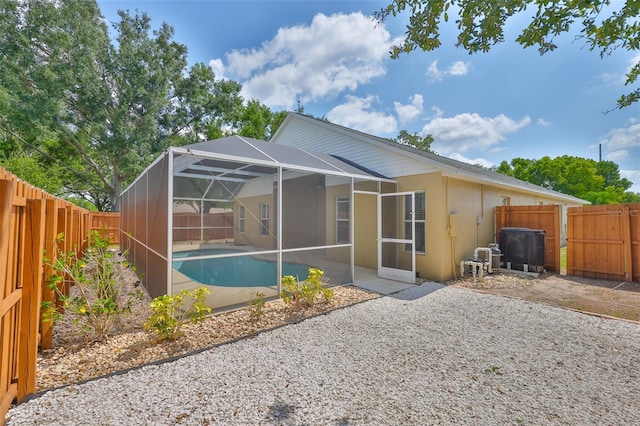 11726 S Stone Ln, Riverview, FL 33569 - back of house featuring a fenced backyard, a patio area, stucco siding, and a lanai