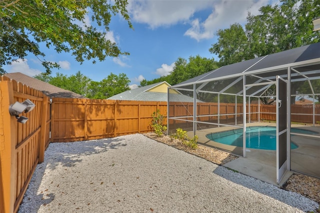 11726 S Stone Ln, Riverview, FL 33569 - view of swimming pool with a fenced backyard, a patio, and a lanai