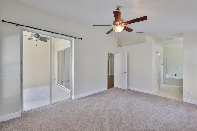 11726 S Stone Ln, Riverview, FL 33569 - unfurnished bedroom featuring light colored carpet, baseboards, a ceiling fan, and ensuite bathroom