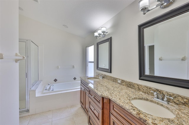 11726 S Stone Ln, Riverview, FL 33569 - bathroom with tile patterned floors, a bath, double vanity, and a stall shower