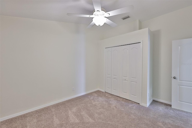11726 S Stone Ln, Riverview, FL 33569 - unfurnished bedroom featuring light colored carpet, a closet, baseboards, and a ceiling fan