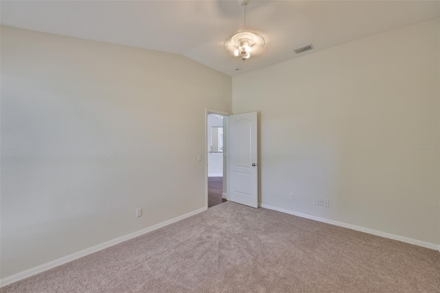 11726 S Stone Ln, Riverview, FL 33569 - spare room featuring carpet flooring, vaulted ceiling, and baseboards
