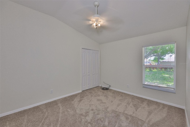 11726 S Stone Ln, Riverview, FL 33569 - empty room featuring vaulted ceiling, carpet floors, baseboards, and a ceiling fan