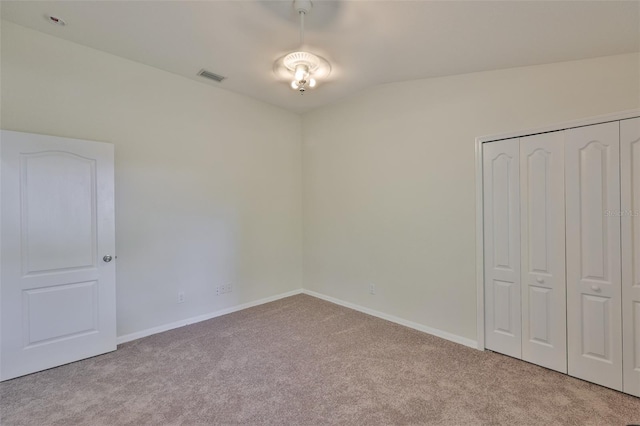11726 S Stone Ln, Riverview, FL 33569 - unfurnished bedroom featuring carpet flooring, a closet, vaulted ceiling, and baseboards