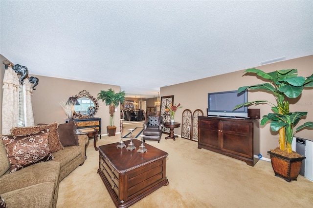 100 Bluff View Dr Unit 514C, Belleair Bluffs, FL 33770 - carpeted living room featuring a textured ceiling