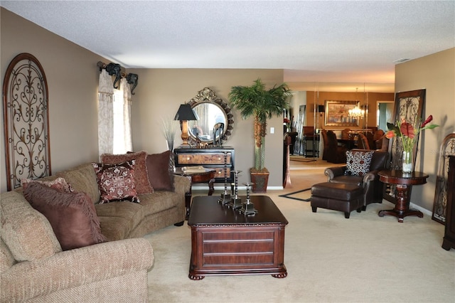 100 Bluff View Dr Unit 514C, Belleair Bluffs, FL 33770 - living area featuring a chandelier, carpet floors, and a textured ceiling