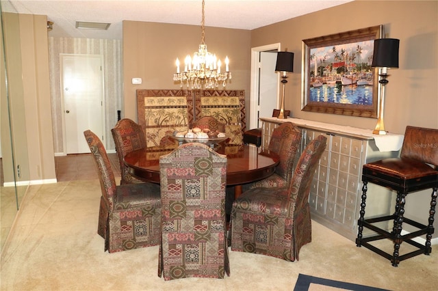 100 Bluff View Dr Unit 514C, Belleair Bluffs, FL 33770 - carpeted dining room featuring a chandelier
