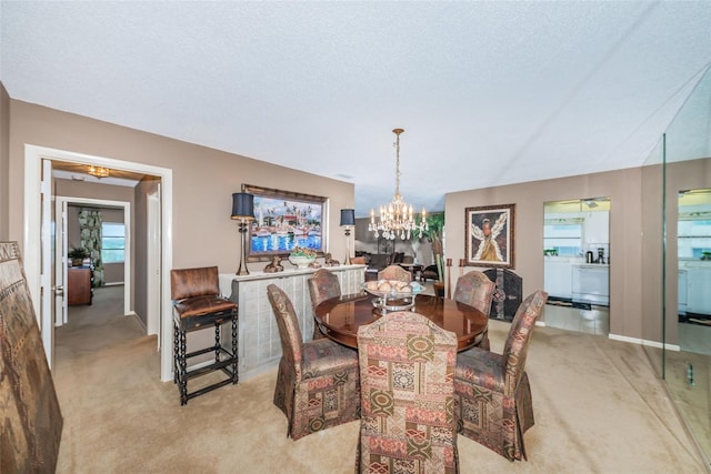 100 Bluff View Dr Unit 514C, Belleair Bluffs, FL 33770 - dining area featuring light carpet and a chandelier