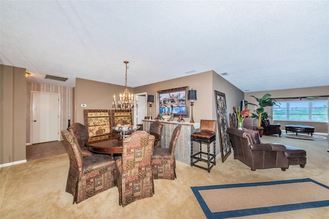 100 Bluff View Dr Unit 514C, Belleair Bluffs, FL 33770 - carpeted dining space with a chandelier and a textured ceiling