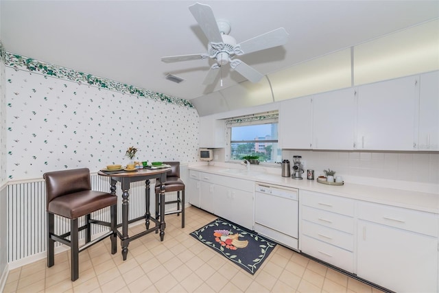 100 Bluff View Dr Unit 514C, Belleair Bluffs, FL 33770 - kitchen featuring dishwasher, light countertops, wallpapered walls, ceiling fan, and a sink