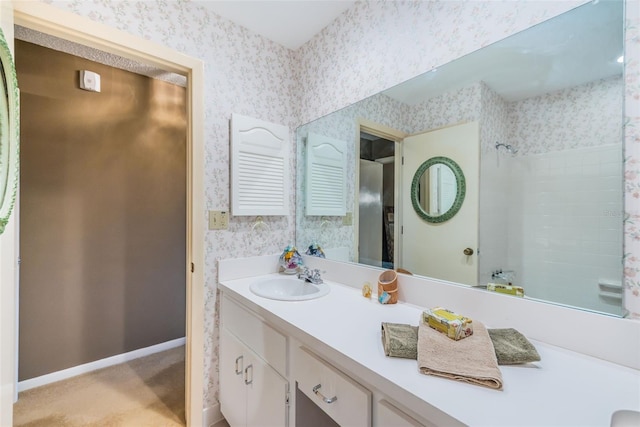 100 Bluff View Dr Unit 514C, Belleair Bluffs, FL 33770 - full bath with wallpapered walls, double vanity, and baseboards