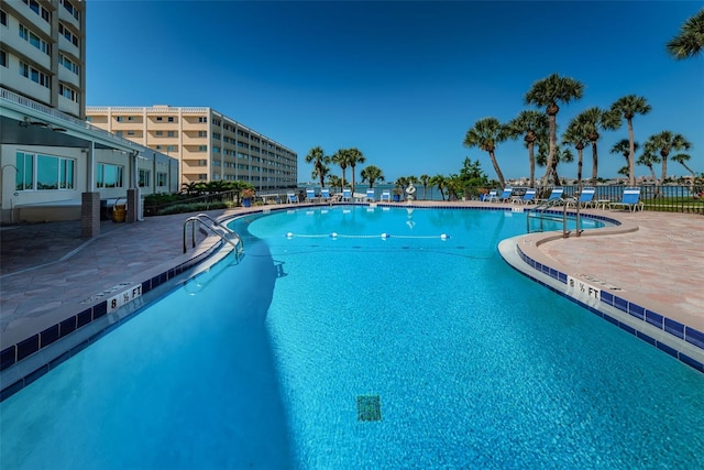 100 Bluff View Dr Unit 514C, Belleair Bluffs, FL 33770 - community pool featuring a patio
