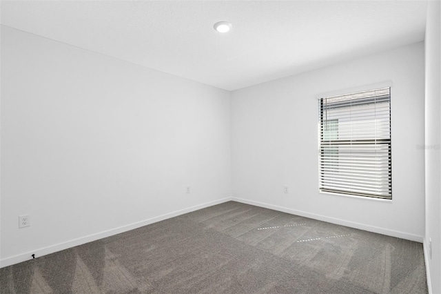 2464 Fairview Ln, Spring Hill, FL 34609 - carpeted empty room featuring baseboards