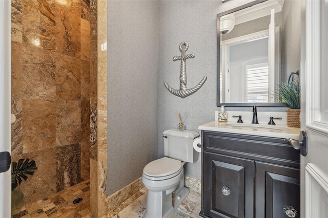 301 Bayview Dr NE, Saint Petersburg, FL 33704 - bathroom featuring a tile shower, vanity, and toilet