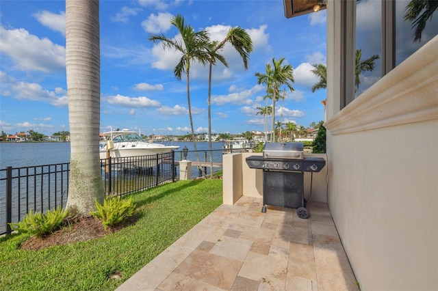 301 Bayview Dr NE, Saint Petersburg, FL 33704 - view of patio / terrace with a grill and a water view
