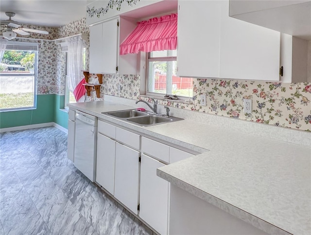 502 Chilt Dr, Brandon, FL 33510 - kitchen with dishwasher, a sink, healthy amount of natural light, light countertops, and wallpapered walls