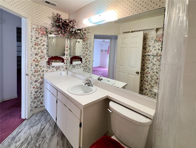 502 Chilt Dr, Brandon, FL 33510 - bathroom featuring wallpapered walls, vanity, toilet, and baseboards