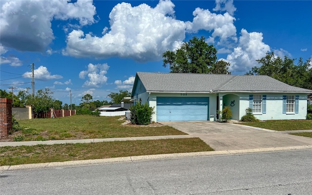 502 Chilt Dr, Brandon, FL 33510 - view of front of property featuring a garage, driveway, stucco siding, and roof with shingles