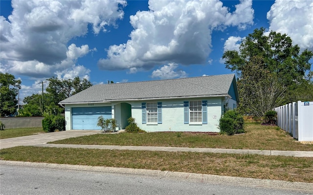 502 Chilt Dr, Brandon, FL 33510 - view of front of house with a garage, driveway, stucco siding, and a shingled roof