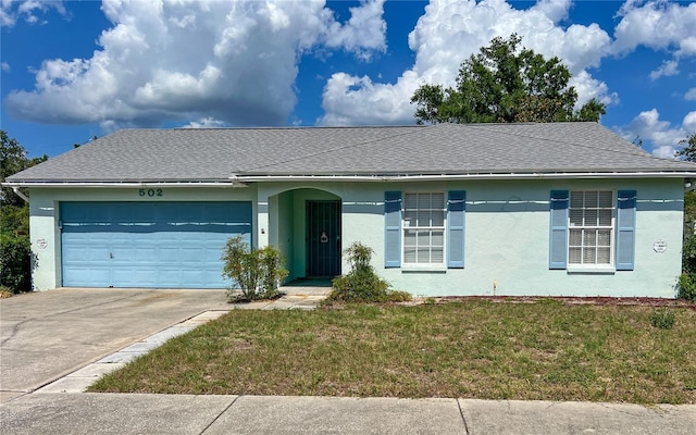 502 Chilt Dr, Brandon, FL 33510 - ranch-style house with stucco siding, a garage, roof with shingles, and a front yard