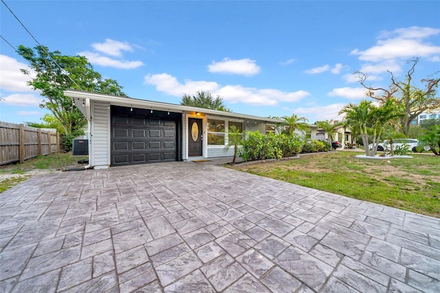 4726 W Fairview Hts, Tampa, FL 33616 - view of front of property featuring an attached garage and driveway