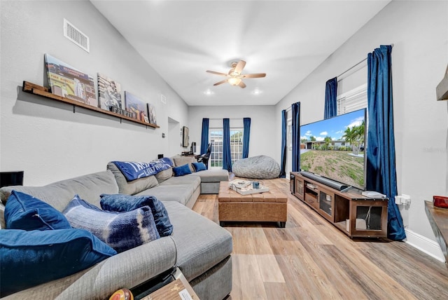 4726 W Fairview Hts, Tampa, FL 33616 - living room featuring light wood-type flooring, ceiling fan, and baseboards