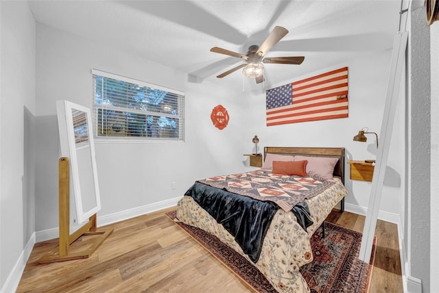 4726 W Fairview Hts, Tampa, FL 33616 - bedroom with wood finished floors, baseboards, and ceiling fan