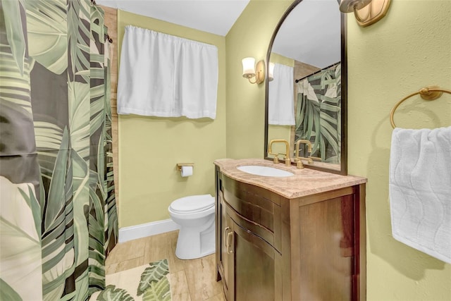 4726 W Fairview Hts, Tampa, FL 33616 - full bathroom with vanity, toilet, baseboards, curtained shower, and wood finished floors